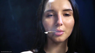 Elegant Brunette Smoking in Black Outfit
