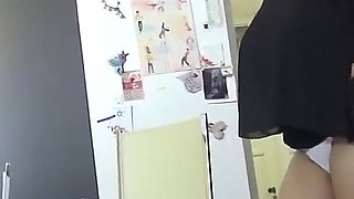 Huge natural titted babe Nadiya strips in the kitchen and oils up her massive melons