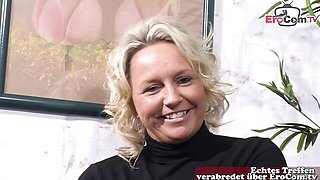 Mature Blonde In Black Boots On Couch