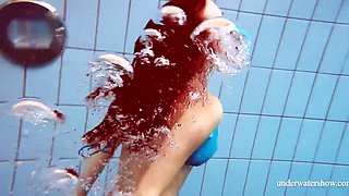 Skinny girl out in the pool cosplaying nirvana album cover underwater