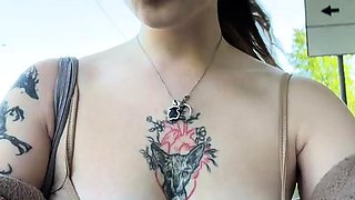 Flirty Tattooed Girl Shows Off Big Tits in Public