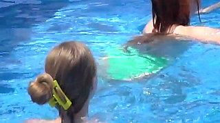 Lesbian Girls Are Having Fun in a Pool with an Inflatable Shark