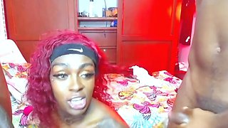 Ebony tgirl sucks and strokes two big black cocks