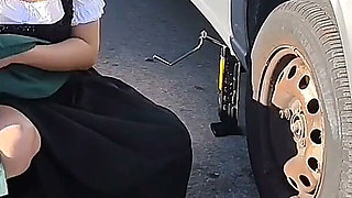 Dirndl Slut Gets Dirty and Oily Changing Tires