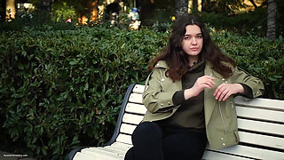 Young Brunette Is Taking an Unhurried Stroll with Allwhite 120mm Cigarette