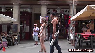 Blond hair girl wrapped in plastic in public