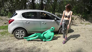 Suited slave gets punished outdoor from femdom chick