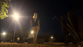 Changing outfit in public park at night and flashing naked.