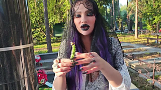 Gothic Witch Wanders the Cemetery, Performs Black Magic Rituals, and Makes You to Worship Her and Satan.